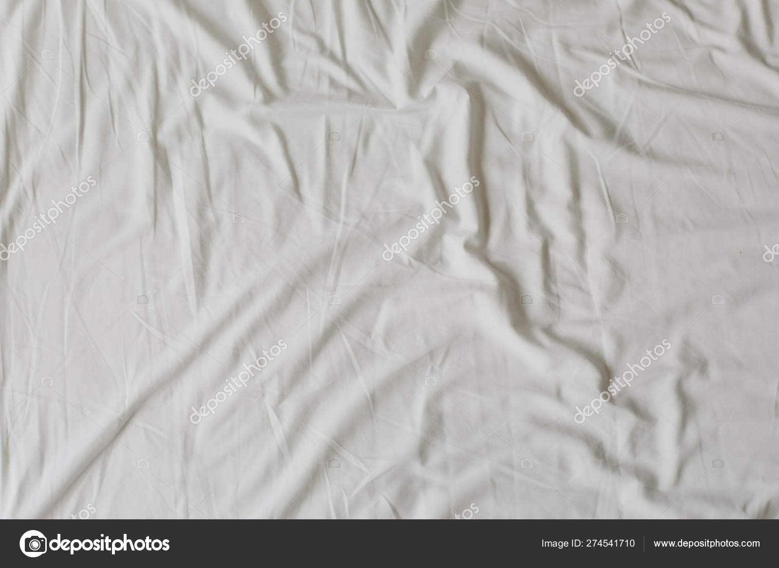 White fabric texture background. Wrinkled, crumpled fabric. Top view of  unmade bed sheet after night sleep. Soft focus Stock Photo by ©gkondratenko  274541710