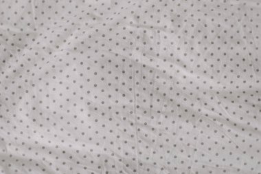 Kumaş doku arka plan. Buruşuk, buruşuk kumaş. Gece uykusundan sonra unmade yatak çarşafı üst görünümü. Yumuşak odaklama