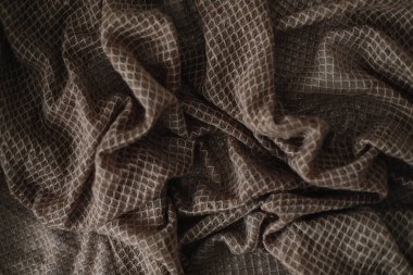 Kumaş doku arka plan. Buruşuk, buruşuk kumaş. Yakın çekim tekstil arka plan. Örme doku deseni. Yumuşak odaklama