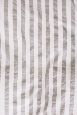 Kumaş doku arka plan. Buruşuk, buruşuk kumaş. Gece uykusundan sonra unmade yatak çarşafı üst görünümü. Yumuşak odaklama