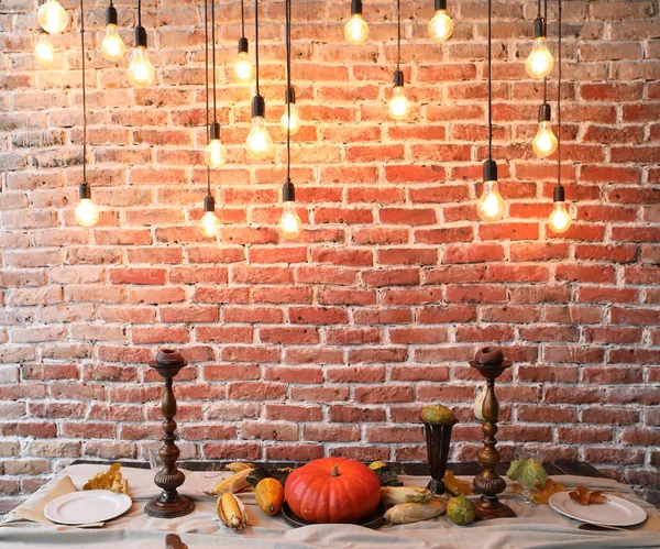 Table setting for Thanksgiving day. Autumn table with pumpkins and candles. fall home decoration for festive dinner — Stock Photo, Image