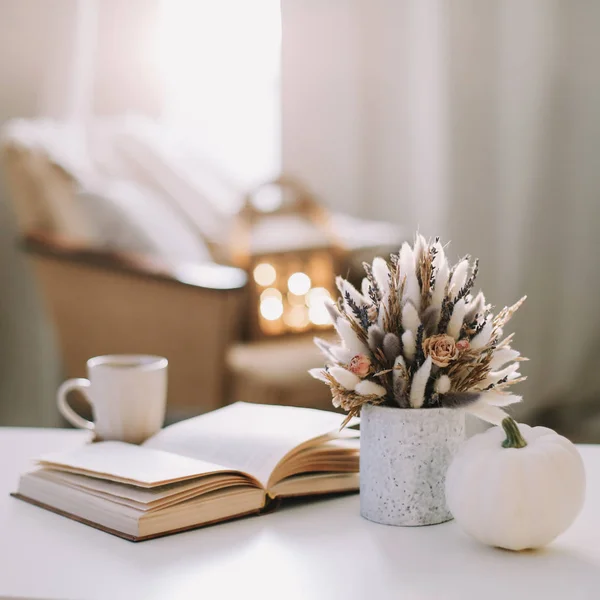 Autumn still life. Coffee cup, flowers, book and pumpkin. Hygge lifestyle, cozy autumn mood. Flat lay, Happy thanksgiving — Stock Photo, Image