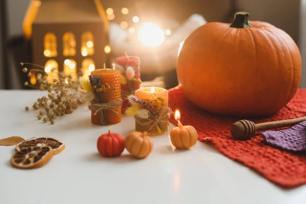 Cozy autumn composition. Pumpkin, wax candles, leaves. Hygge lifestyle, cozy autumn mood. Halloween, Happy Thanksgiving concept — Stock Photo, Image