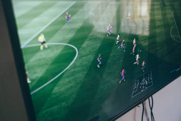 TV with the image of the game on FIFA Russian version on the Microsoft Xbox, a video game console.