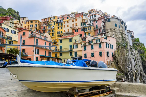 beach streets and colorful houses on the hill in Manarola in Cinque Terre in Italy