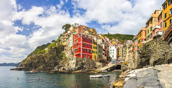 beach streets and colorful houses on the hill in Riomaggiore in Cinque Terre in Italy