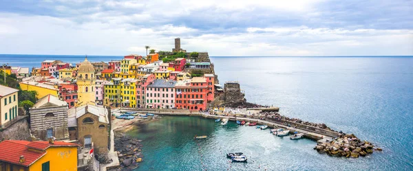 beach streets and colorful houses on the hill in Vernazza in Cinque Terre in Italy