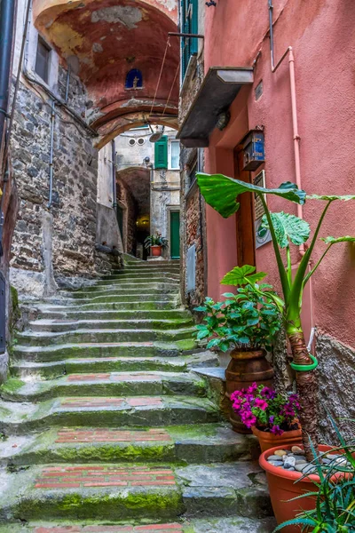 beach streets and colorful houses on the hill in Vernazza in Cinque Terre in Italy