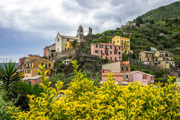 Beach streets and colorful houses on the hill in Vernazza in Cinque Terre in Italy