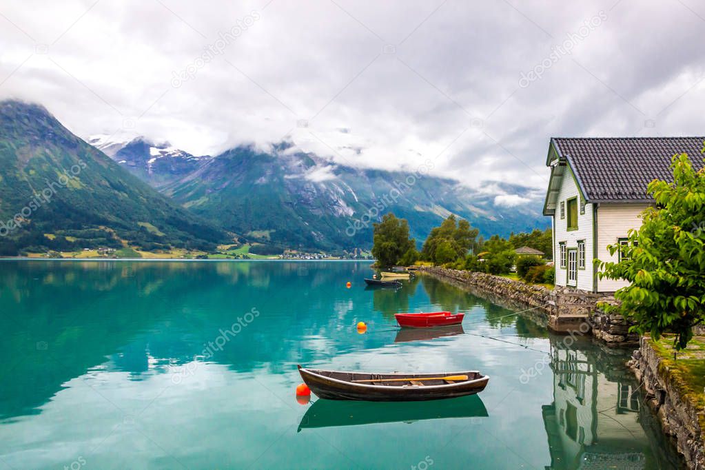 clouds over Oppstryn lake in mountains in Norway