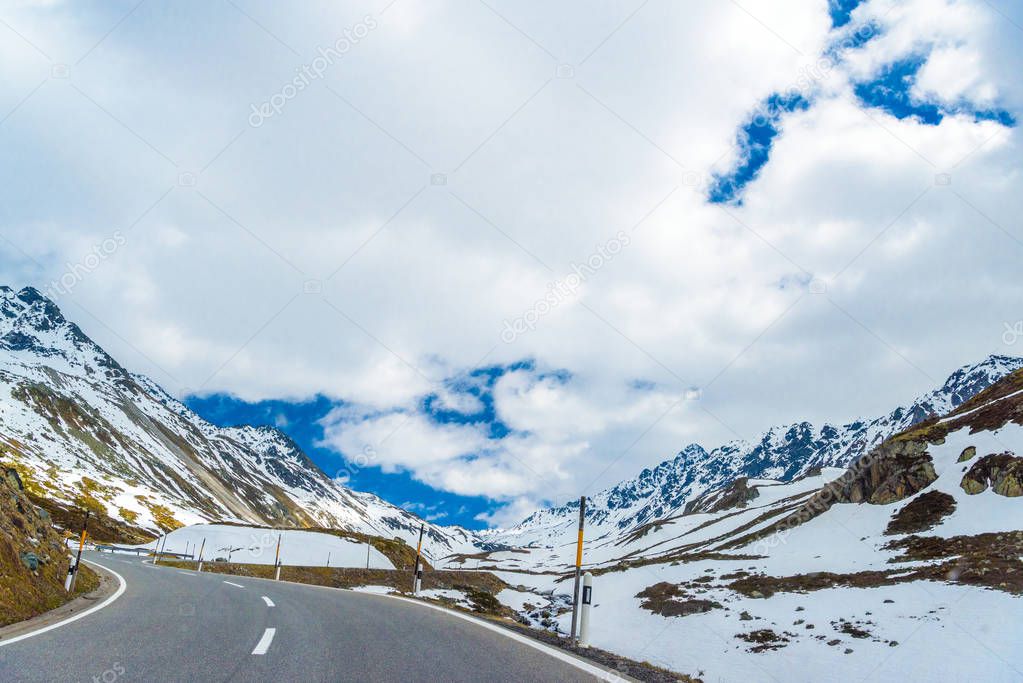 Road amoung snowy Alps mountains, Fluelapass, Davos,  Graubuenden Switzerland