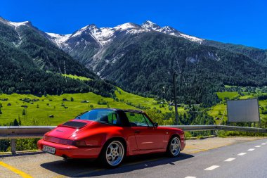 FILET, SWITZERLAND - APR 2017: Red Porsche 911 993 cabrio in Swiss Alps, Moerel, Filet, Oestlich Raron, Wallis Valais Switzerland