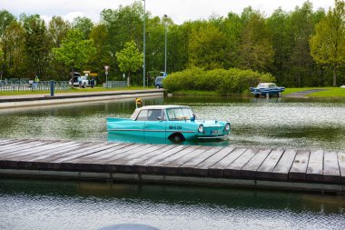 FRIEDRICHSHAFEN - MAY 2019: azure AMPHICAR 770 1961 cabrio at Motorworld Classics Bodensee on May 11, 2019 in Friedrichshafen, Germany clipart