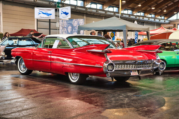 FRIEDRICHSHAFEN - MAY 2019: white red CADILLAC COUPE DE VILLE 1959 coupe at Motorworld Classics Bodensee on May 11, 2019 in Friedrichshafen, Germany