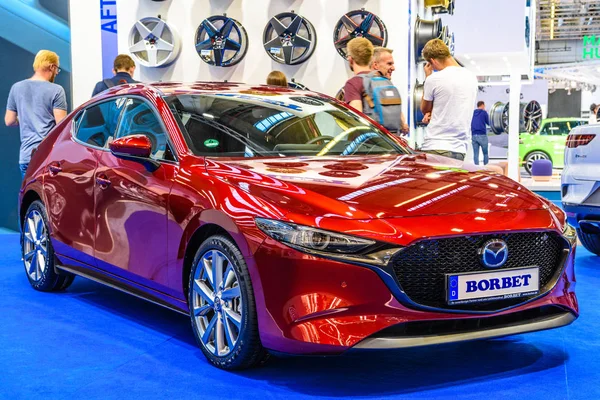 FRANKFURT, GERMANY - SEPT 2019: red MAZDA 3 Borbet 4th generation BP hatchback, IAA International Motor Show Auto Exhibtion — Stok fotoğraf