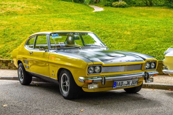 BADEN BADEN, GERMANY - JULY 2019: yellow black FORD CAPRI MK I 2800 1969 1974 sport coupe, oldtimer meeting in Kurpark Stock Photo