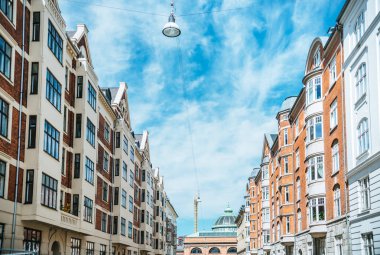 urban scene with beautiful architecture of copenhagen and cloudy sky, denmark clipart