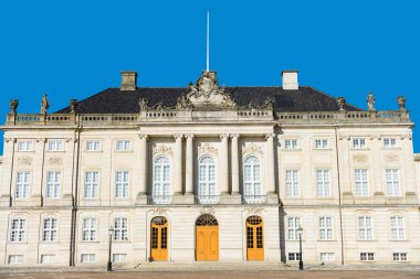 beautiful architecture of historical Amalienborg castle with columns and statues in copenhagen, denmark clipart