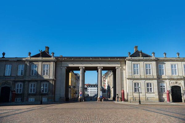 COPENHAGEN, DENMARK - MAY 6, 2018: Columns and historical buildings on square with pavement, copenhagen, denmark
