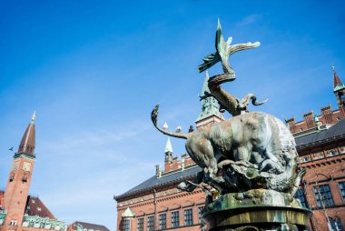 COPENHAGEN, DENMARK - MAY 6, 2018: Dragon Fountain at city hall square during daytime clipart