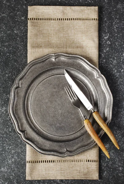 Vintage Empty Plate Fork Knife Napkin Dark Grey Stone Background — Stock Photo, Image