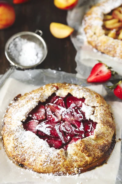 Homemade open pie galette with strawberry and peaches. — Stock Photo, Image