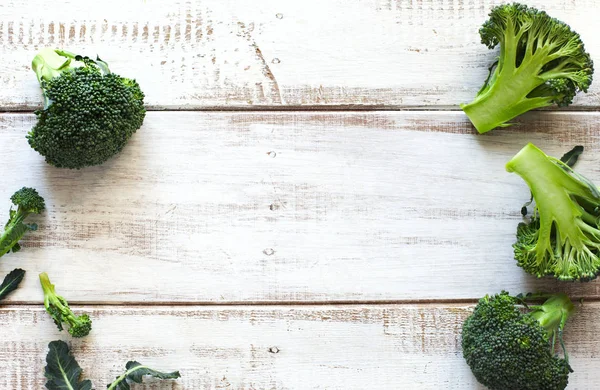 Fresh green broccoli on wooden background — Stock Photo, Image