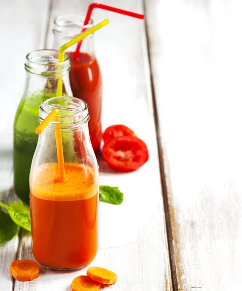 Fruits and vegetable juice in bottle. — Stock Photo, Image
