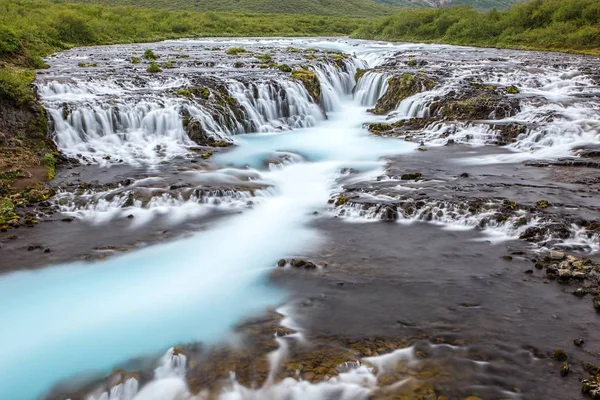 Bright powerful Bruarfoss waterfall in Iceland with cyan water. — Stock Photo, Image