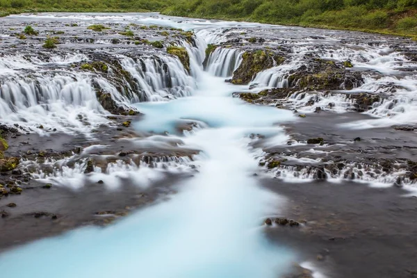 Detail of bright powerful Bruarfoss waterfall in Iceland with cyan water. — Stock Photo, Image