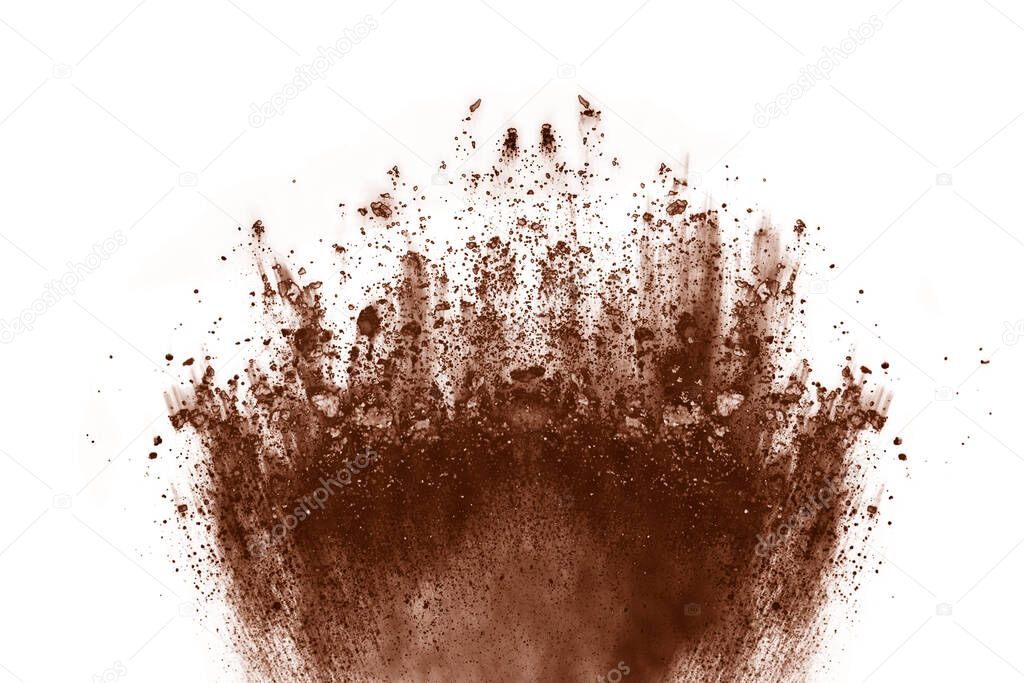 Brown color powder explosion on white background. Colored cloud. Colorful dust explode. Paint Holi.