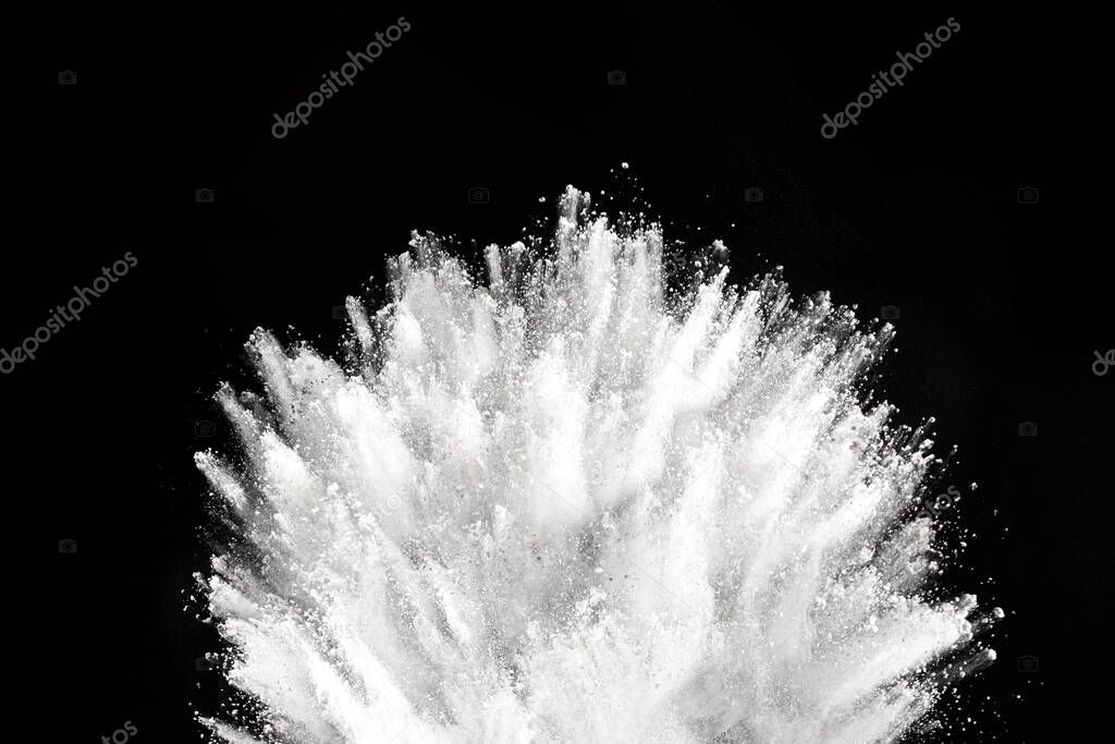 White powder explosion on black background. Colored cloud. Colorful dust explode. Paint Holi.