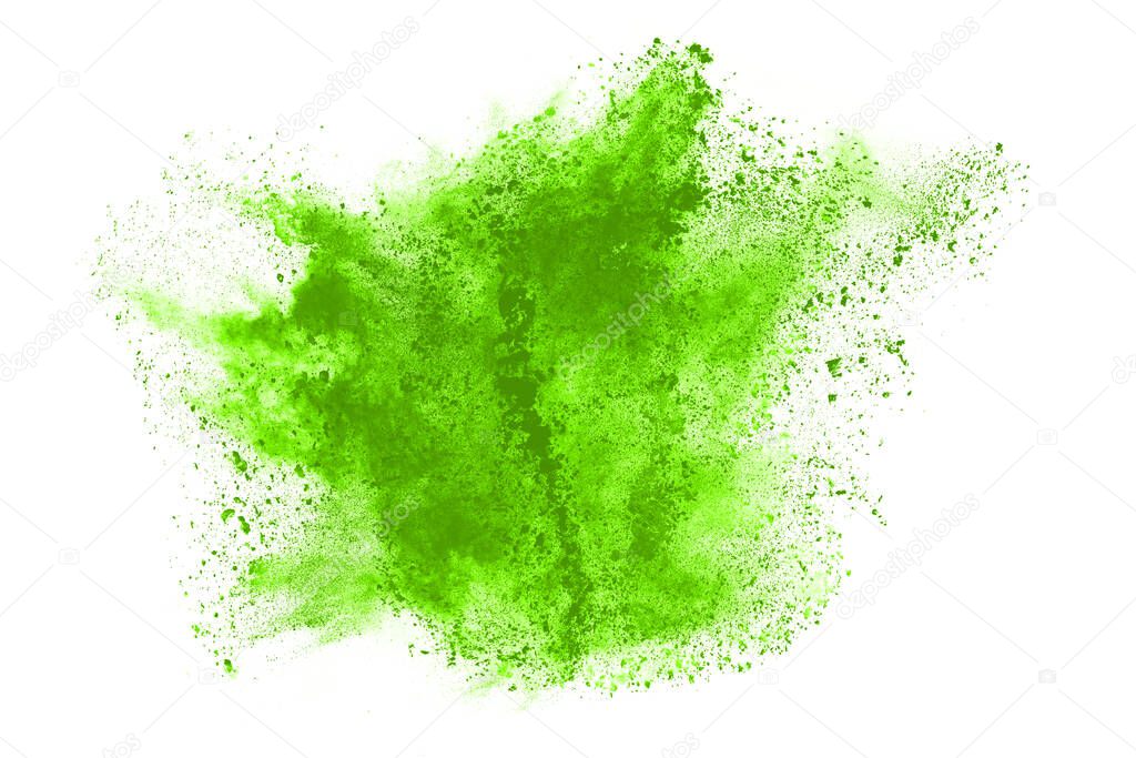 abstract powder splatted background,Freeze motion of green powder exploding,throwing orange dust on white background.
