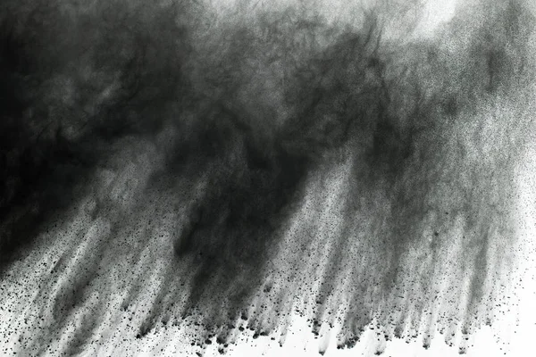 particles of charcoal on white background,abstract powder splatted on white background,Freeze motion of black powder exploding or throwing black powder.