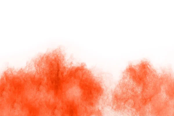 abstract orange powder splatted background,Freeze motion of color powder exploding/throwing color powder,color glitter texture on white background.