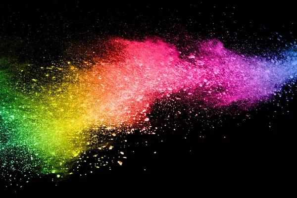 abstract colored dust explosion on a black background.abstract powder splatted background,Freeze motion of color powder exploding/throwing color powder, multicolored glitter texture.