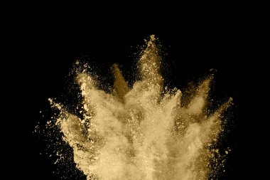 Siyah arka planda altın tozu patlaması. Renkli bulut. Renkli toz patlar. Boya Holi.