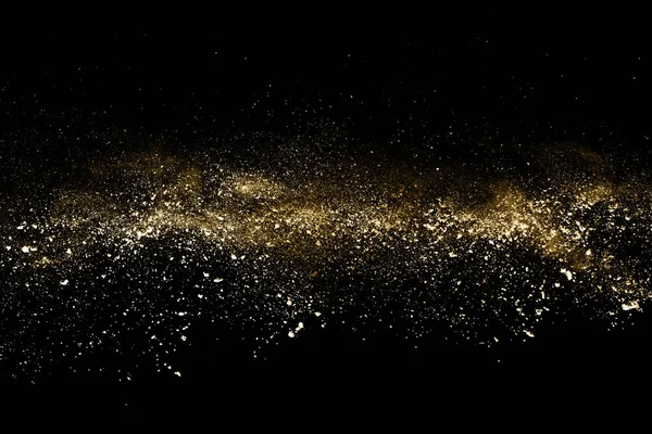 Siyah arka planda altın tozu patlaması. Renkli bulut. Renkli toz patlar. Boya Holi.
