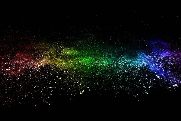 abstract colored dust explosion on a black background.abstract powder splatted background,Freeze motion of color powder exploding/throwing color powder, multicolored glitter texture.