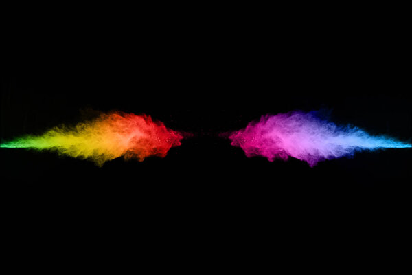 abstract colored dust explosion on a black background.abstract powder splatted background,Freeze motion of color powder exploding/throwing color powder, multicolored glitter texture.