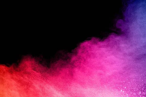 abstract colored dust explosion on a black background.abstract powder splatted background,Freeze motion of color powder exploding/throwing color powder, multicolored glitter texture.