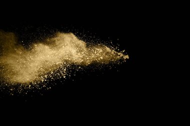 Siyah arka planda altın tozu patlaması. Renkli bulut. Renkli toz patlar. Boya Holi.