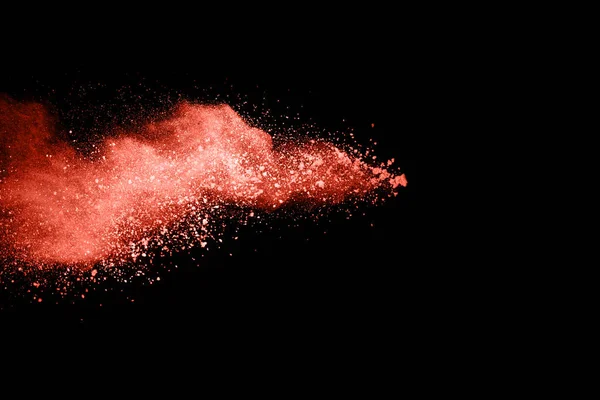 要旨生きているサンゴの粉体のメッキの背景 色の粉の爆発 投げ色の粉の凍結運動 黒の背景に色の輝きのテクスチャ — ストック写真