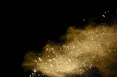 Siyah arka planda altın tozu patlaması. Renkli bulut. Renkli toz patlar. Boya Holi.