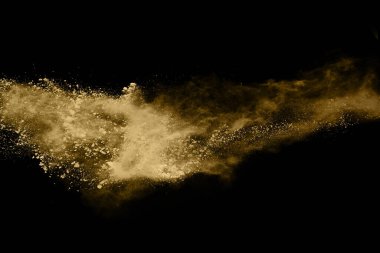Siyah arka planda altın tozu patlaması. Renkli bulut. Renkli toz patlar. Boya Holi.
