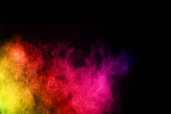 abstract colored dust explosion on a black background.abstract powder splatted background,Freeze motion of color powder exploding/throwing color powder, multicolored glitter texture.