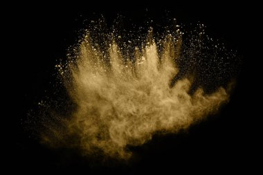 Siyah arka planda altın tozu patlaması. Renkli bulut. Renkli toz patlar. Boya Holi.