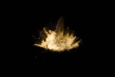 Siyah arka planda altın tozu patlaması. Renkli bulut. Renkli toz patlar. Boya Holi.