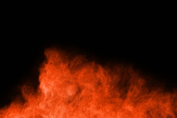 Siyah Arkaplanda Turuncu Toz Fırlatıldı — Stok fotoğraf
