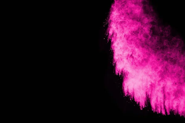 stock image Pink powder explosion on black background. Colored cloud. Colorful dust explode. Paint Holi.
